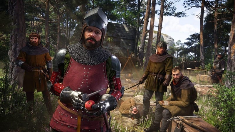 A group of medieval bandits gathered in a forest camp in Kingdom Come: Deliverance II, with one armored man holding an apple and others resting or standing nearby.